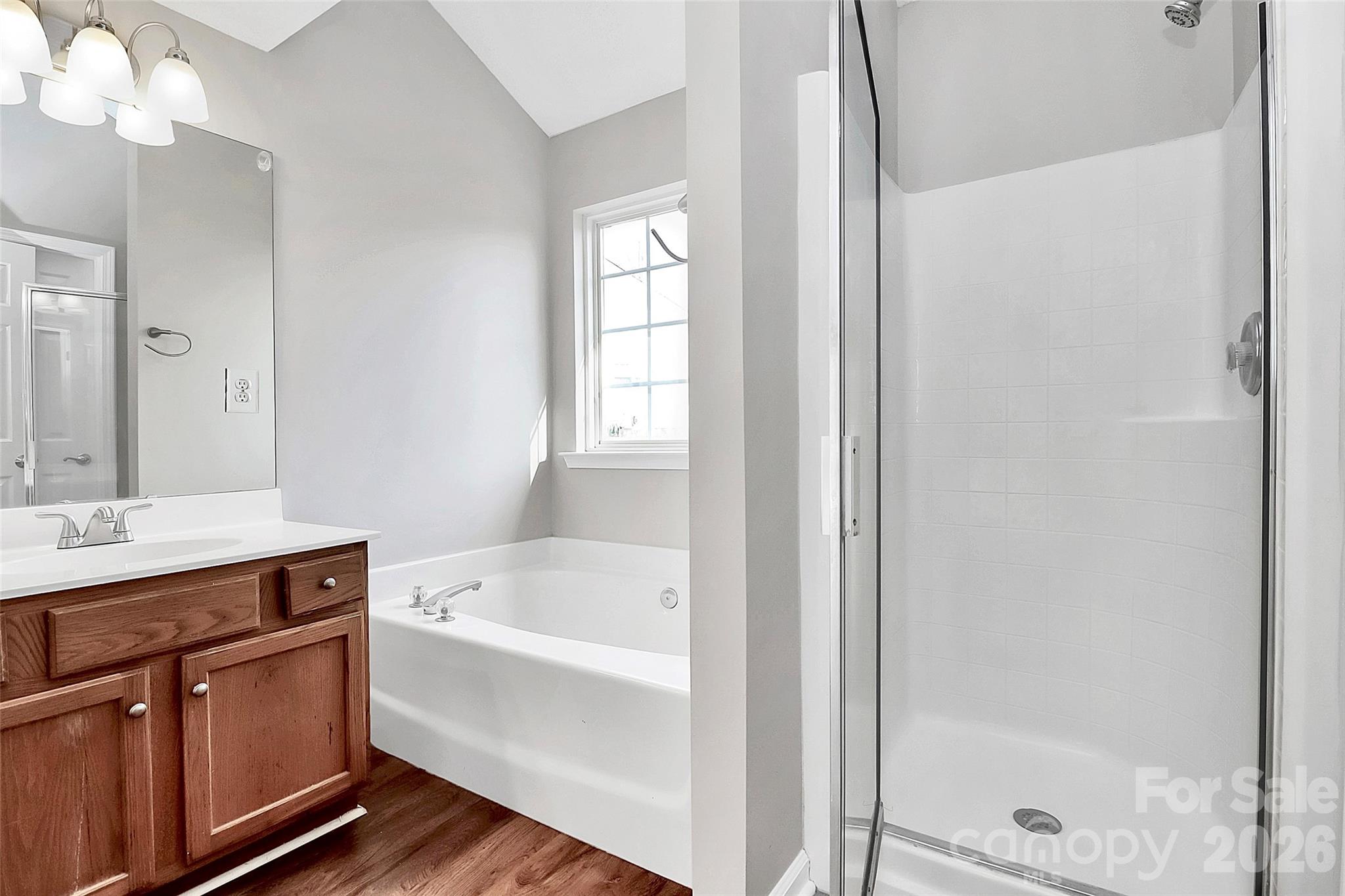1044 Sandy Point Drive Southwest Concord, NC 28025 - Photo 17 of 32 a bathroom with a bathtub and a sink