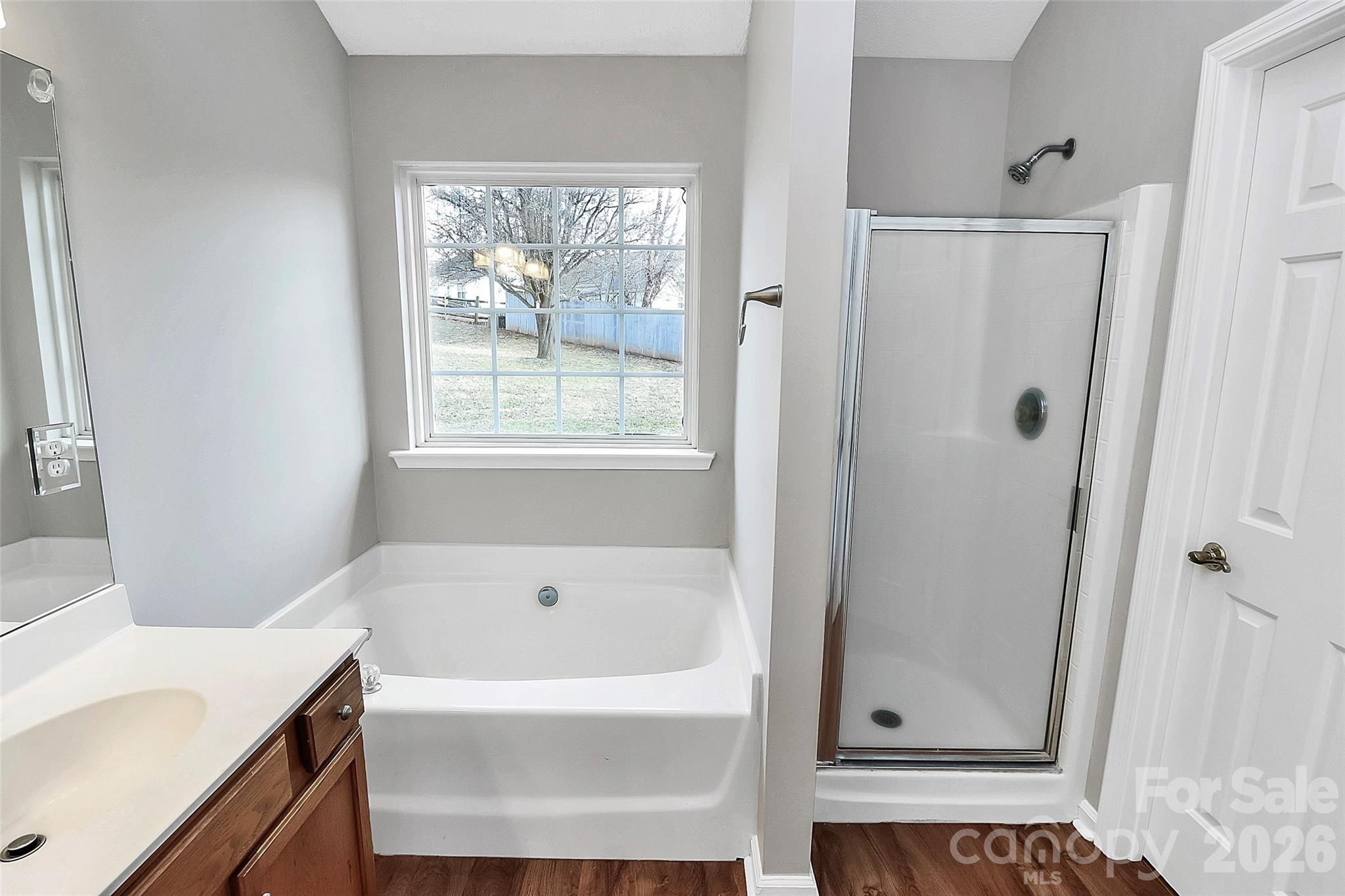 1044 Sandy Point Drive Southwest Concord, NC 28025 - Photo 19 of 32 a white bath tub sitting next to a white sink