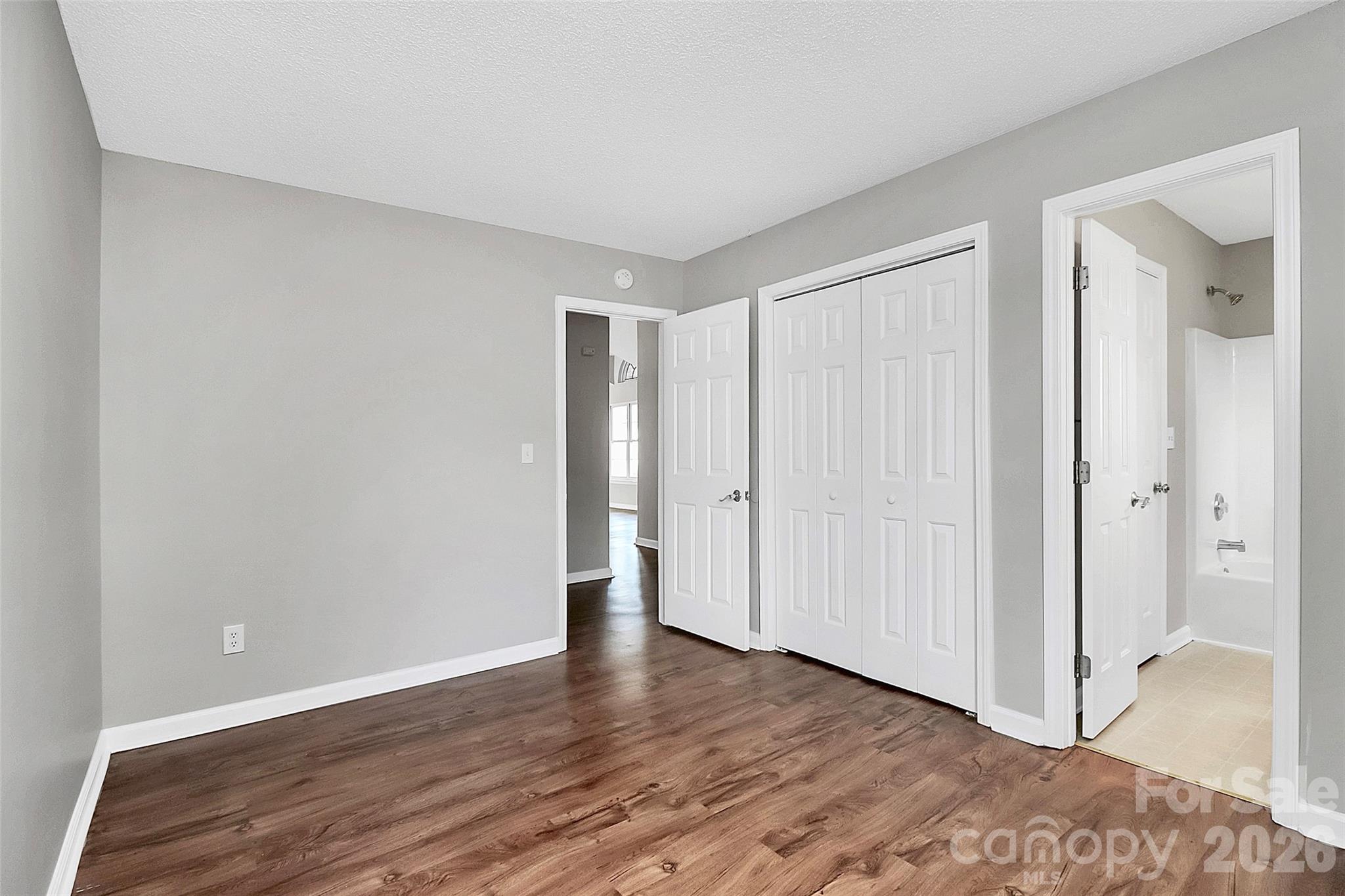 1044 Sandy Point Drive Southwest Concord, NC 28025 - Photo 22 of 32 a view of an empty room and wooden floor
