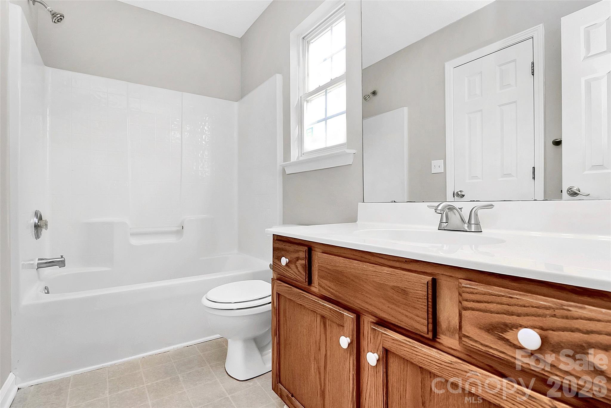 1044 Sandy Point Drive Southwest Concord, NC 28025 - Photo 25 of 32 a bathroom with a sink a toilet and shower