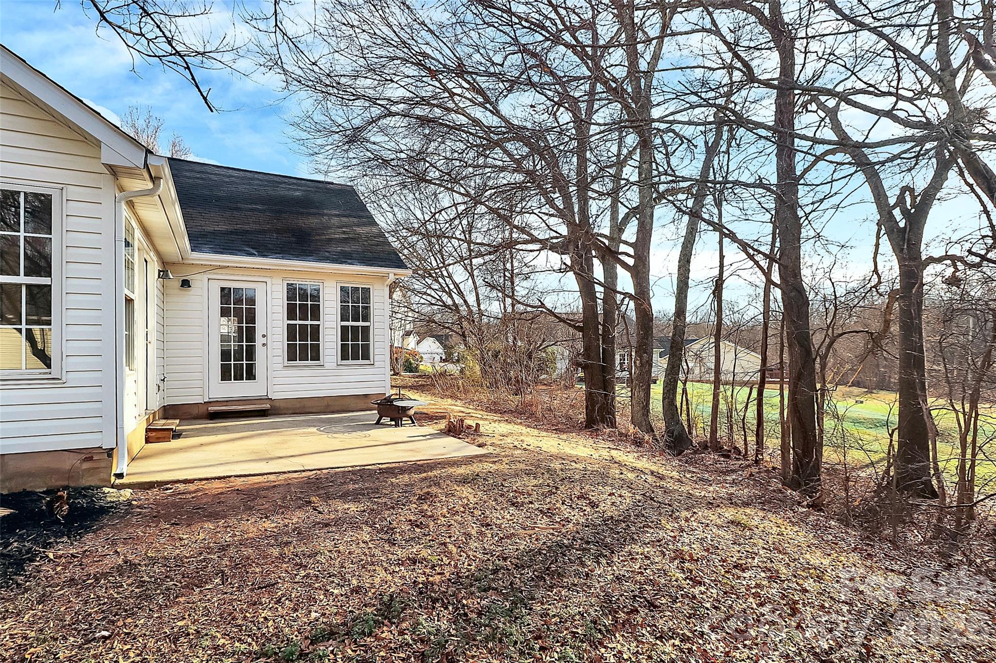1044 Sandy Point Drive Southwest Concord, NC 28025 - Photo 29 of 32 a view of a house with backyard and trees