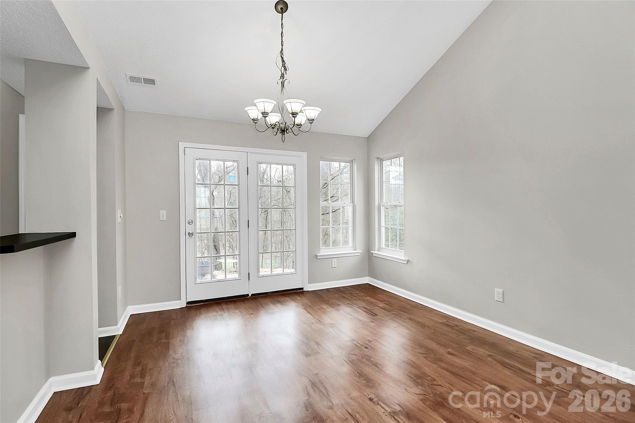 1044 Sandy Point Drive Southwest Concord, NC 28025 - Photo 10 of 32 a view of empty room with wooden floor and fan