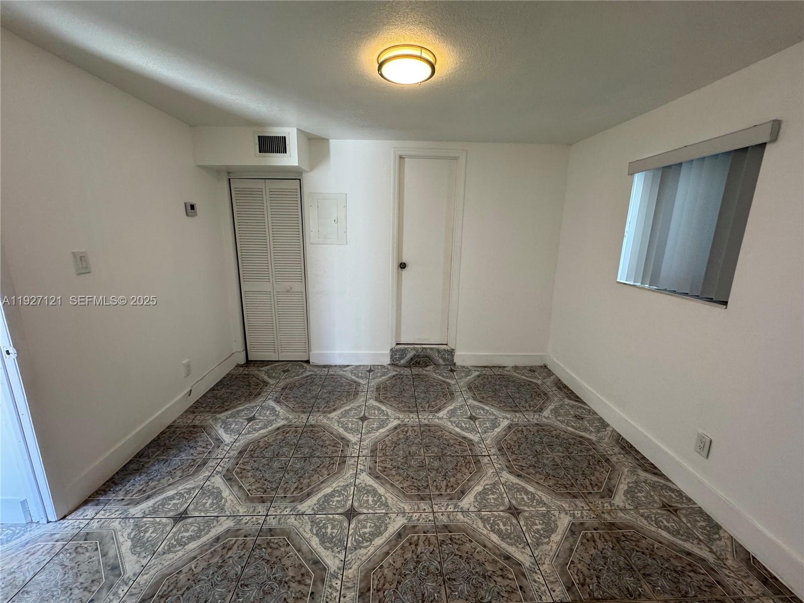 169 Northeast 50th Street, Unit 2 Miami, FL 33137 - Photo 11 of 16 a view of an empty room