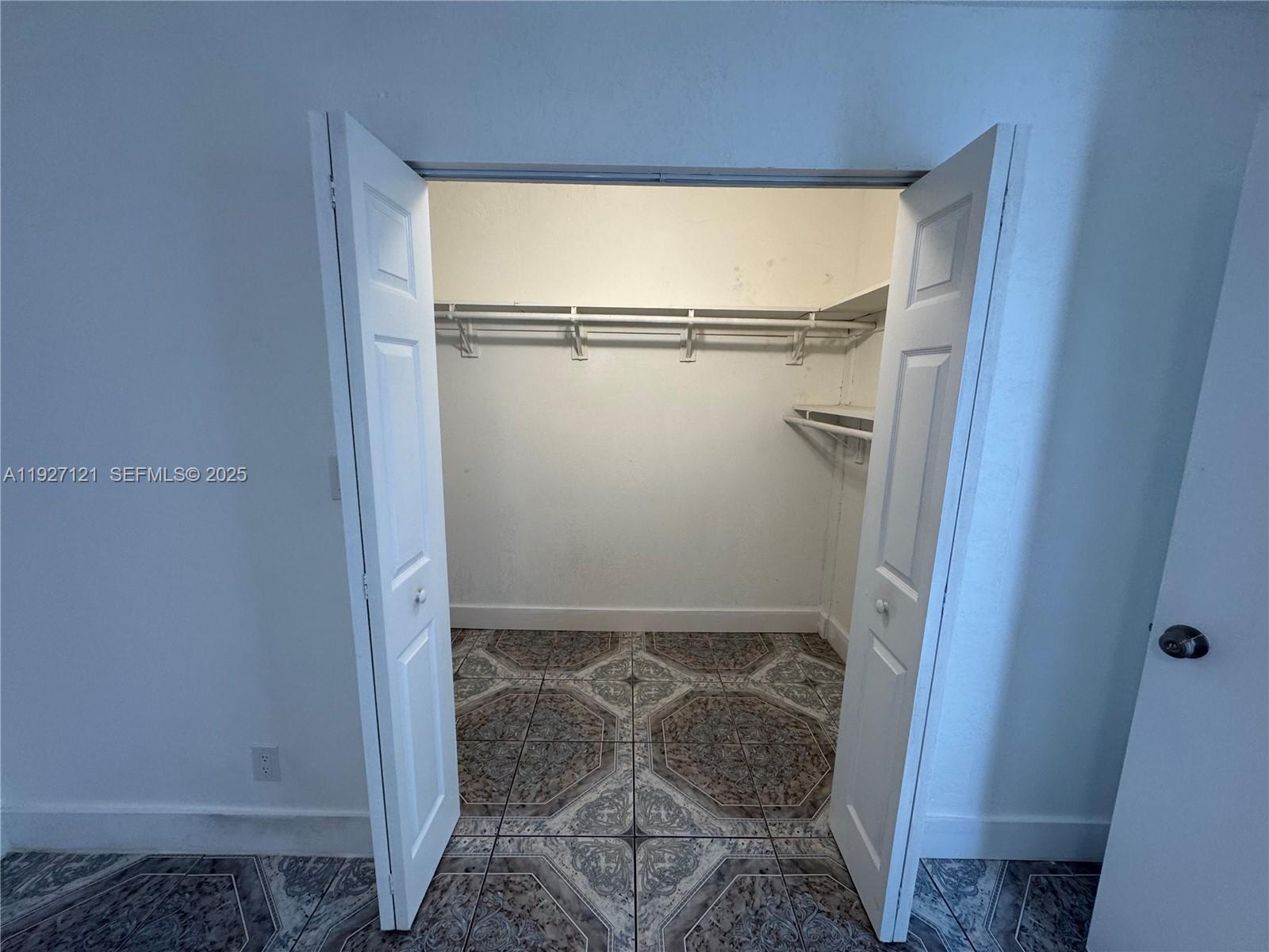 169 Northeast 50th Street, Unit 2 Miami, FL 33137 - Photo 13 of 16 a bathroom with a glass shower door