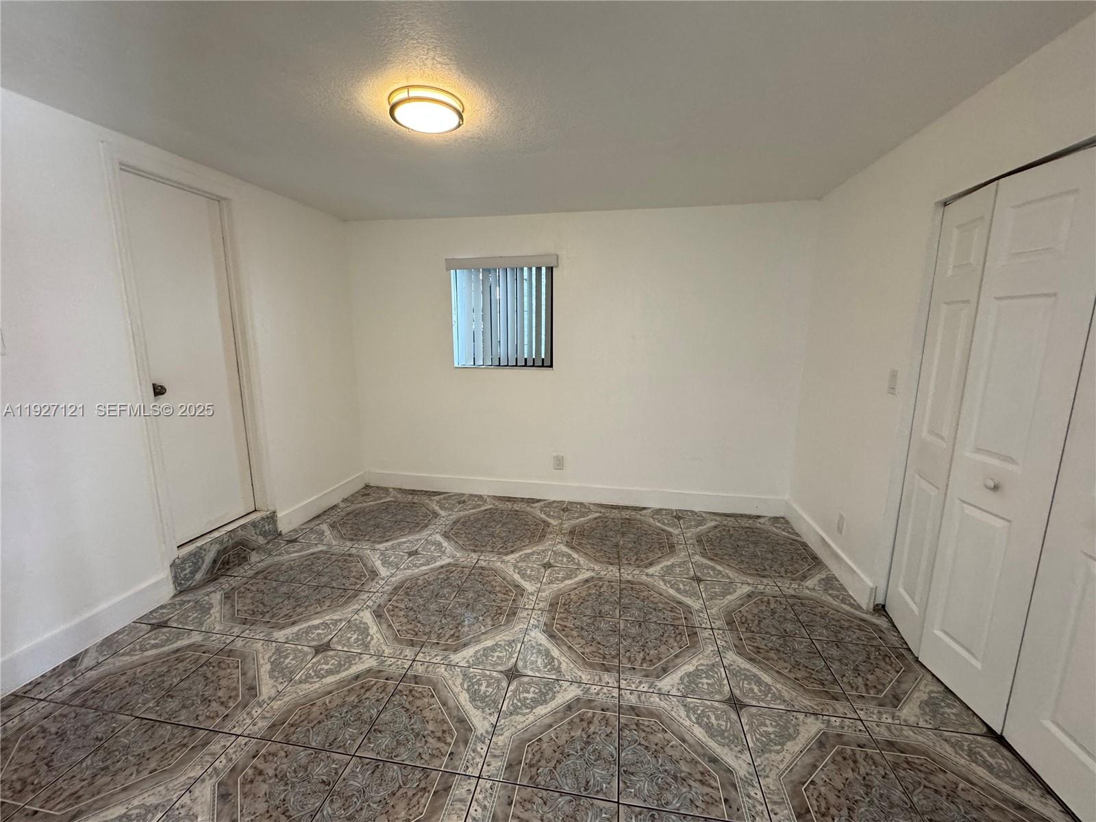 169 Northeast 50th Street, Unit 2 Miami, FL 33137 - Photo 7 of 16 a view of an empty room