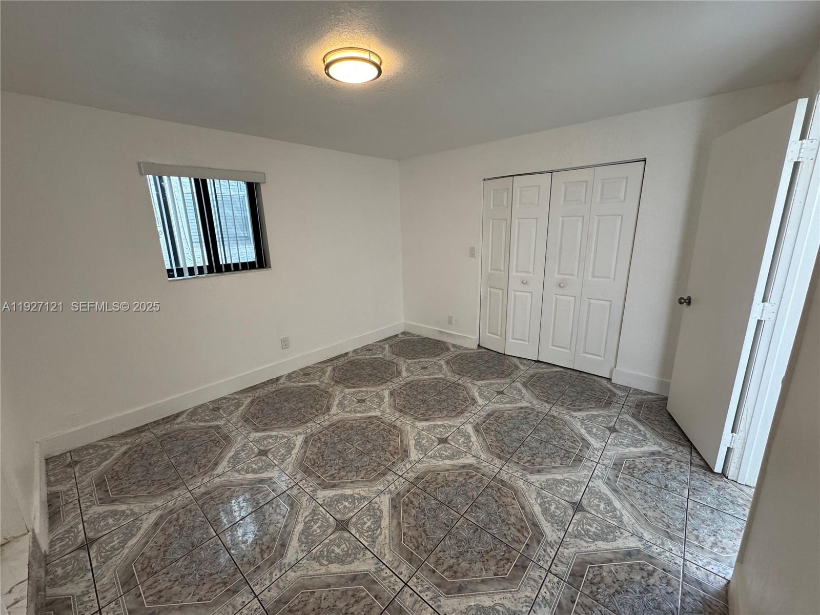 169 Northeast 50th Street, Unit 2 Miami, FL 33137 - Photo 8 of 16 a view of an empty room