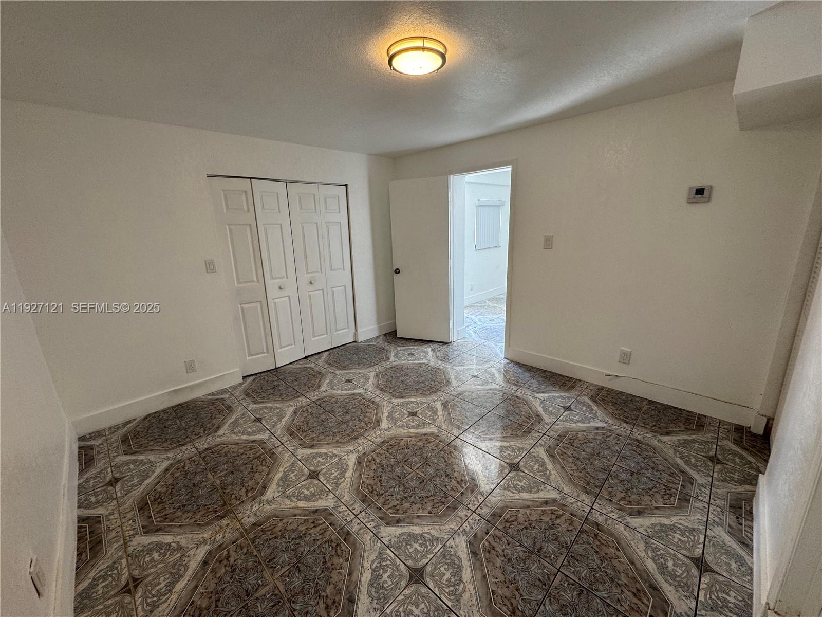 169 Northeast 50th Street, Unit 2 Miami, FL 33137 - Photo 9 of 16 a view of an empty room