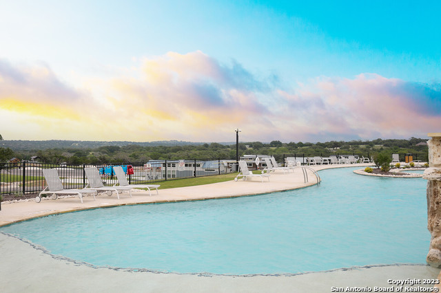 5386 Ranch Road 1376, Unit 191 Fredericksburg, TX 78624 - Photo 12 of 23 a view of a lake with a city