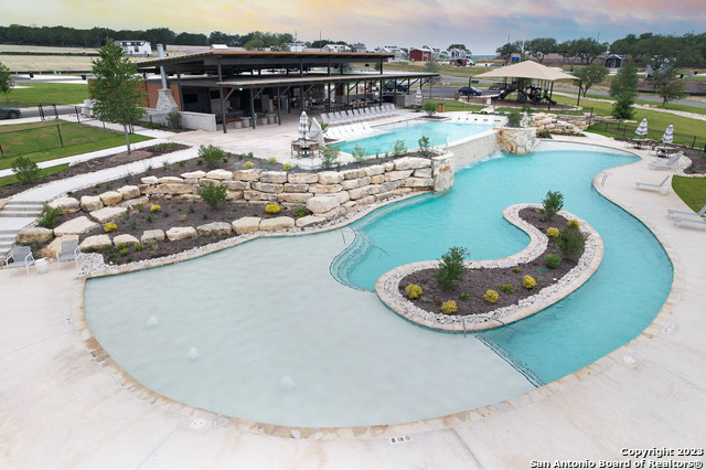5386 Ranch Road 1376, Unit 191 Fredericksburg, TX 78624 - Photo 13 of 23 a view of a swimming pool with a lake