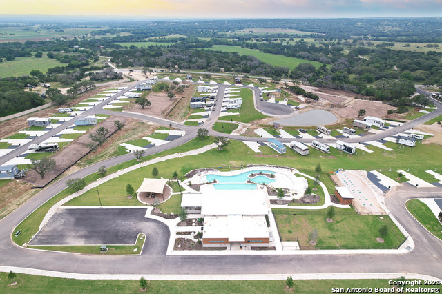 5386 Ranch Road 1376, Unit 191 Fredericksburg, TX 78624 - Photo 14 of 23 an aerial view of residential houses with outdoor space