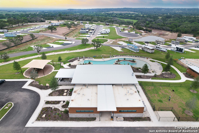5386 Ranch Road 1376, Unit 191 Fredericksburg, TX 78624 - Photo 15 of 23 an aerial view of residential houses with outdoor space and city view