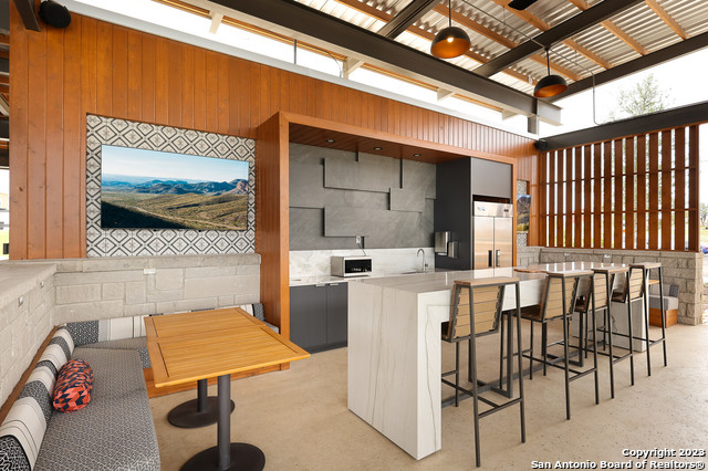 5386 Ranch Road 1376, Unit 191 Fredericksburg, TX 78624 - Photo 19 of 23 a patio with a table and chairs