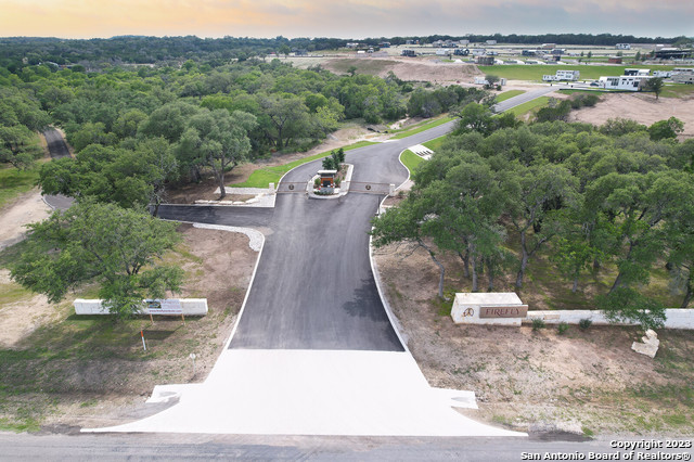 5386 Ranch Road 1376, Unit 191 Fredericksburg, TX 78624 - Photo 3 of 23 an aerial view of a house with a yard and lake view