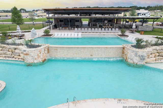 5386 Ranch Road 1376, Unit 191 Fredericksburg, TX 78624 - Photo 8 of 23 a view of swimming pool with outdoor seating and yard