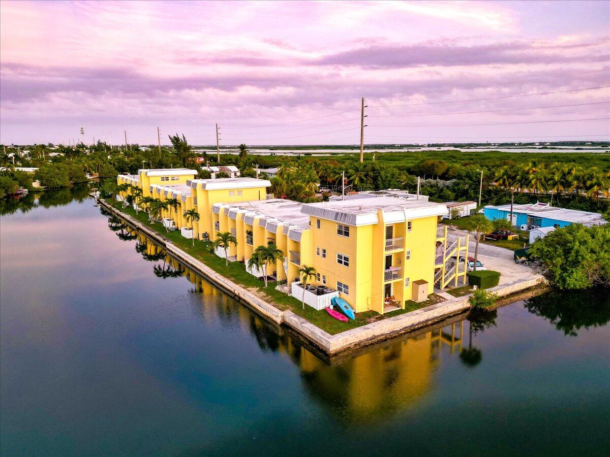 201 Coppitt Road, Unit 202A Key West, FL 33040 - Photo 16 of 21 a view of swimming pool with outdoor seating and a city view