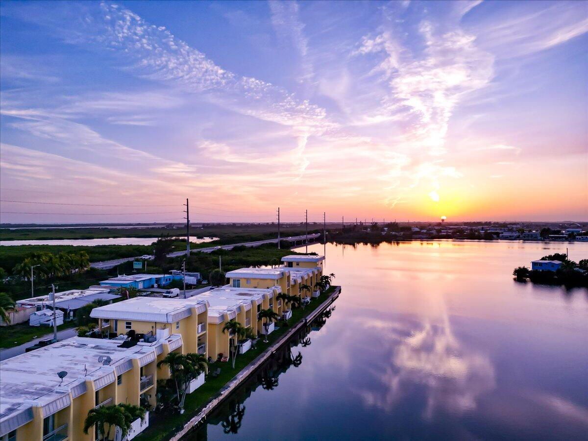 201 Coppitt Road, Unit 202A Key West, FL 33040 - Photo 17 of 21 a view of an ocean with city from a lake
