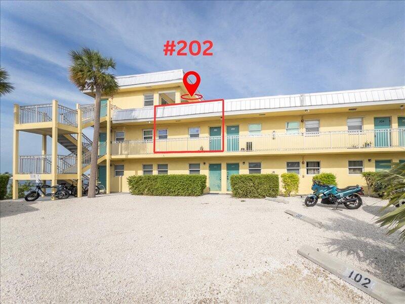 201 Coppitt Road, Unit 202A Key West, FL 33040 - Photo 19 of 21 a front view of a building with a street