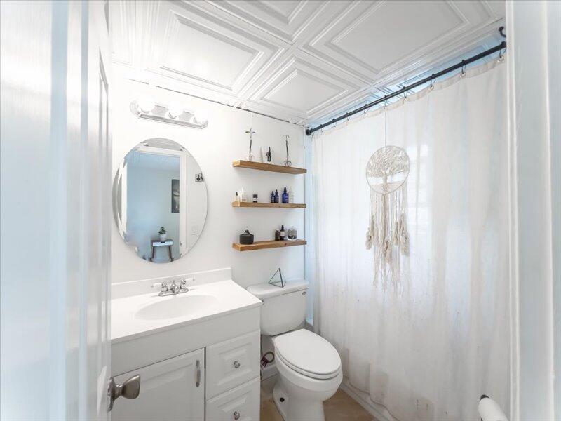 201 Coppitt Road, Unit 202A Key West, FL 33040 - Photo 10 of 21 a bathroom with a sink toilet and shower