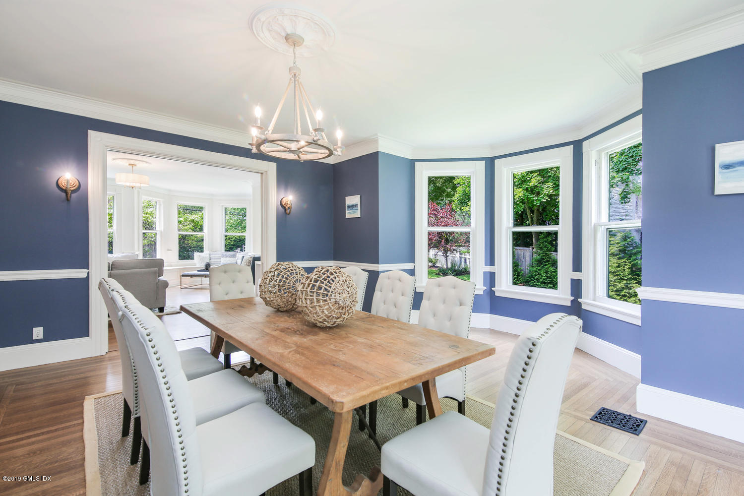 115 Riverside Avenue Riverside, CT 06878 - Photo 11 of 28 a view of a dining room with furniture a chandelier and wooden floor
