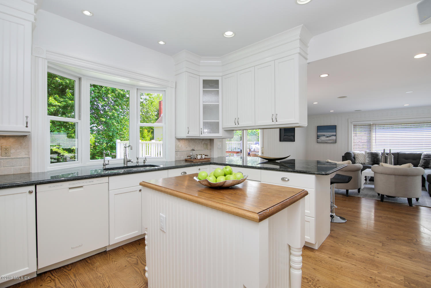 115 Riverside Avenue Riverside, CT 06878 - Photo 13 of 28 a view of a kitchen counter space a sink a window and living room