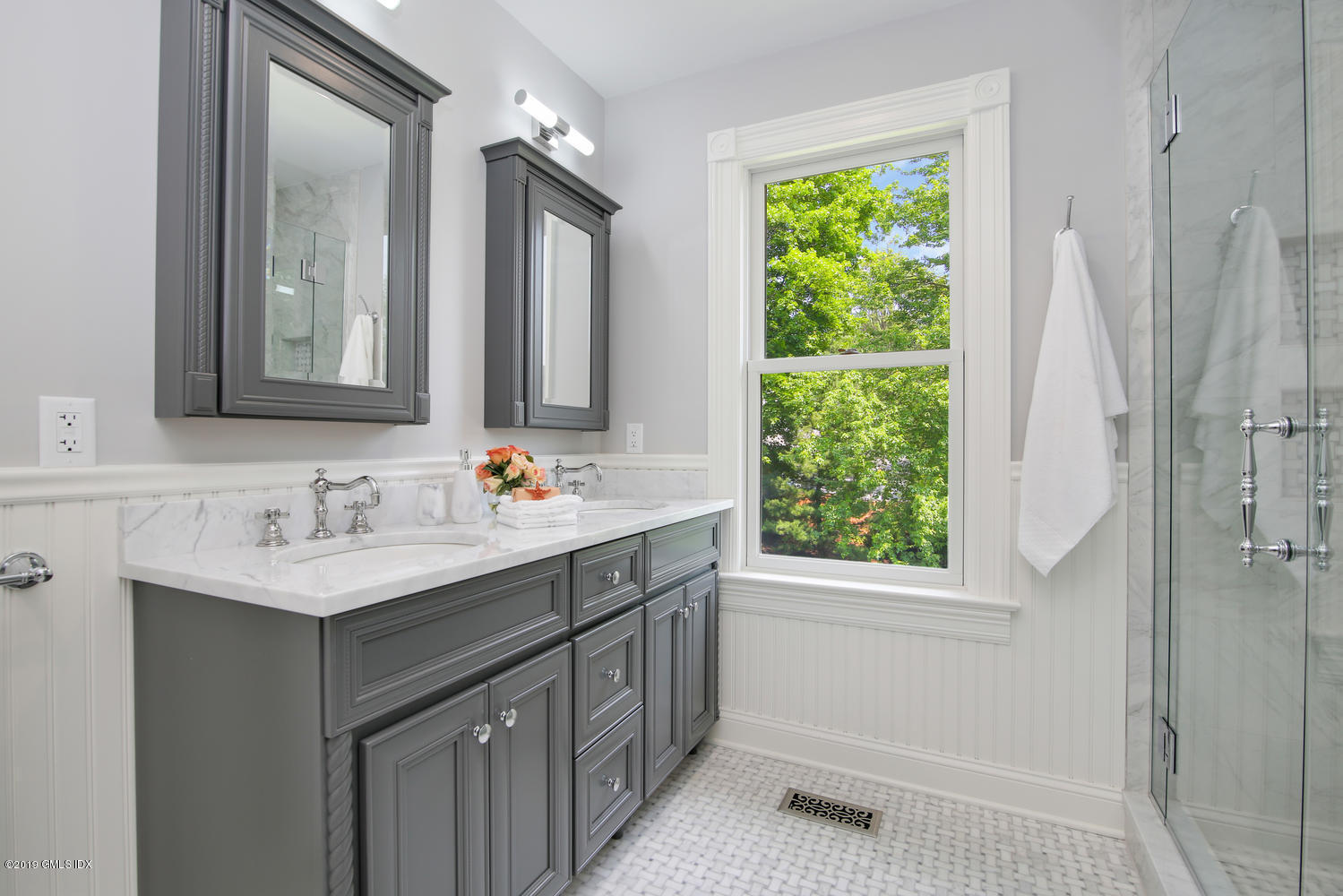 115 Riverside Avenue Riverside, CT 06878 - Photo 18 of 28 a bathroom with a sink a mirror and a window