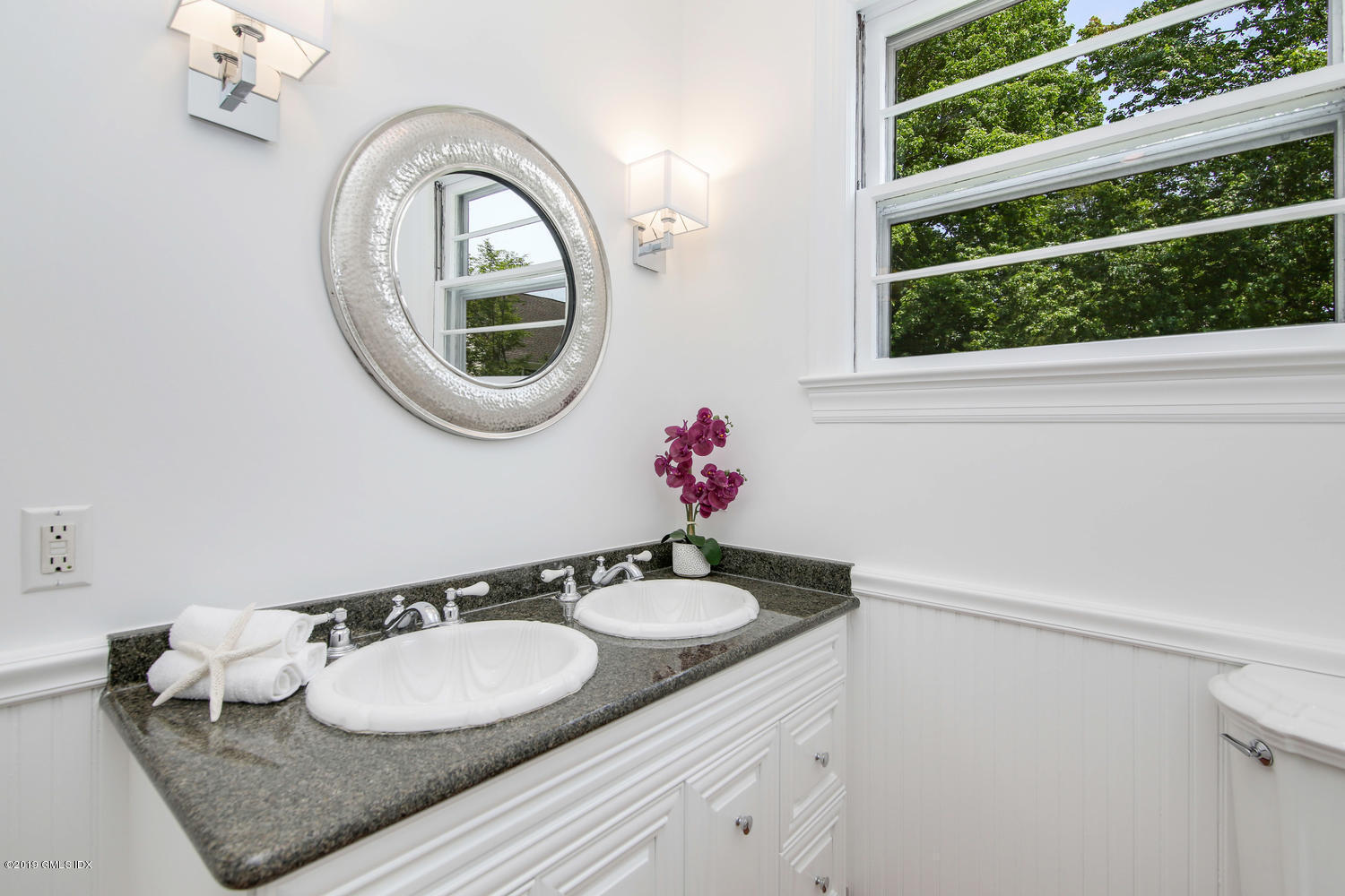 115 Riverside Avenue Riverside, CT 06878 - Photo 19 of 28 a bathroom with a granite countertop sink and a mirror
