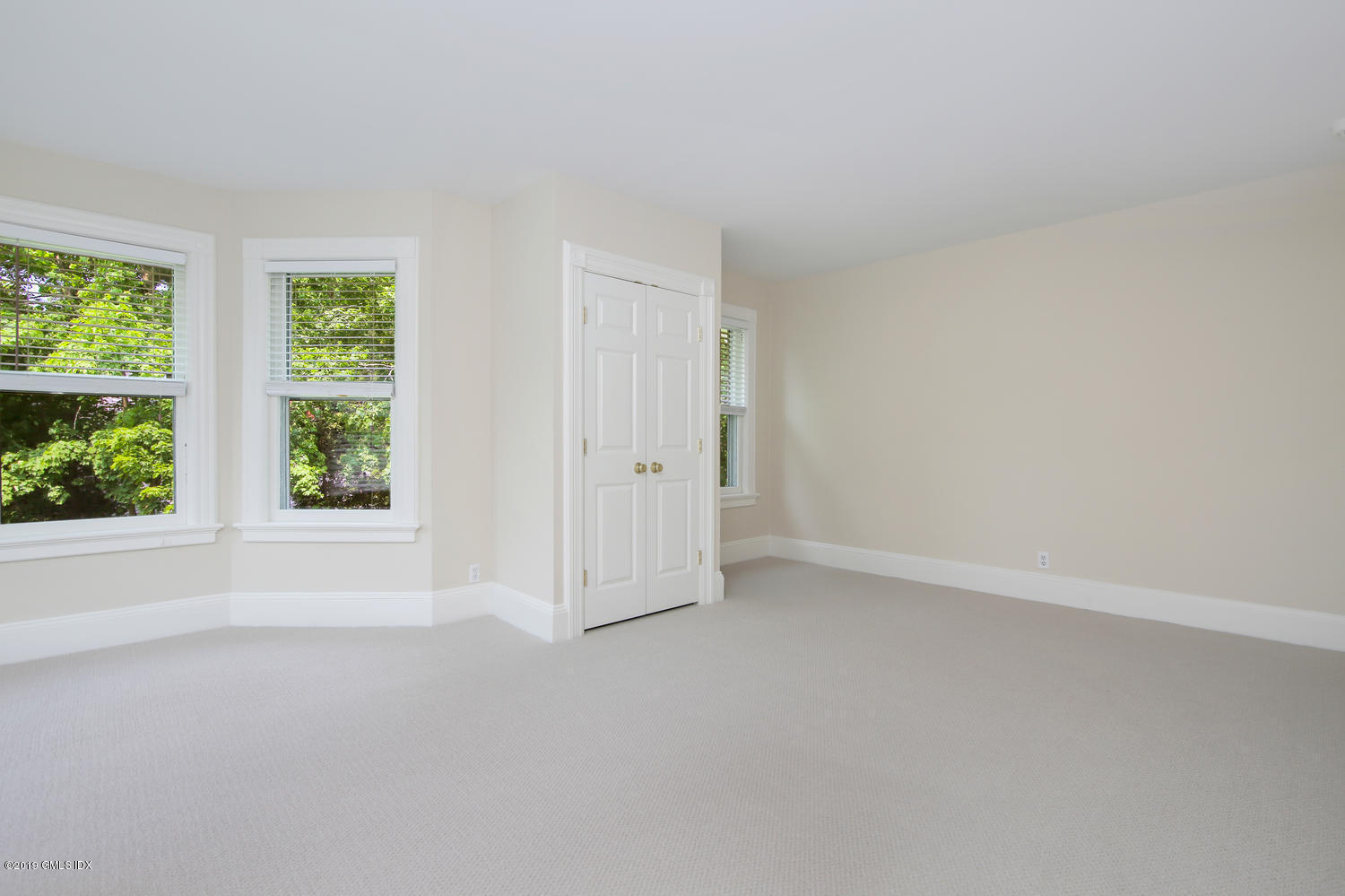 115 Riverside Avenue Riverside, CT 06878 - Photo 20 of 28 an empty room with windows