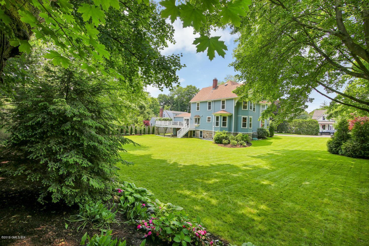 115 Riverside Avenue Riverside, CT 06878 - Photo 2 of 28 a view of house with a big yard