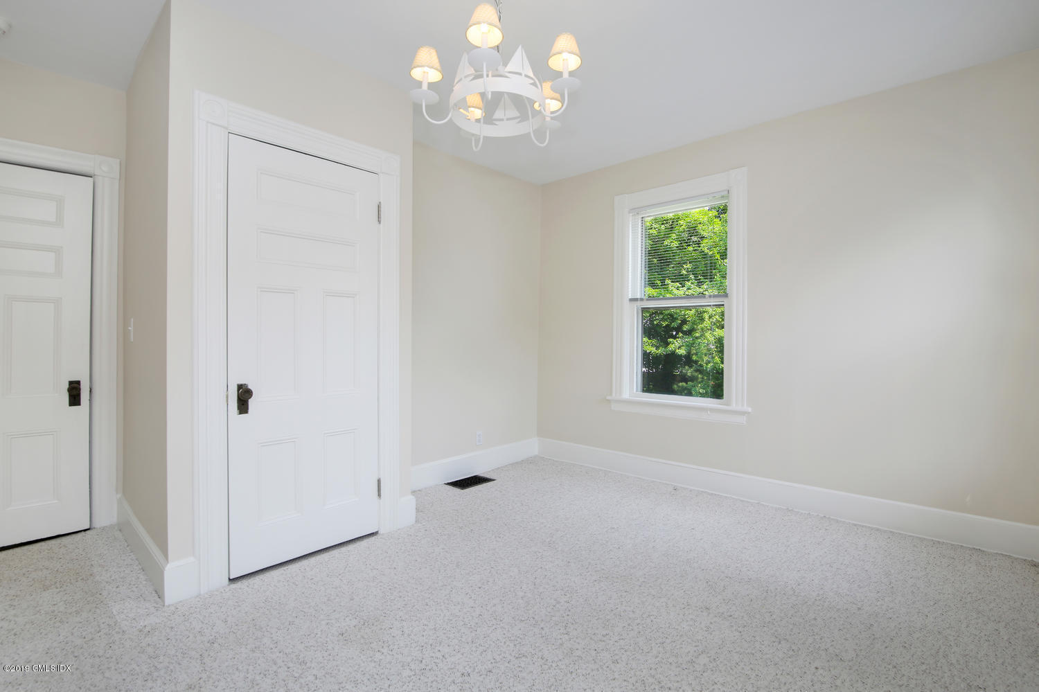 115 Riverside Avenue Riverside, CT 06878 - Photo 22 of 28 a view of an empty room with a window