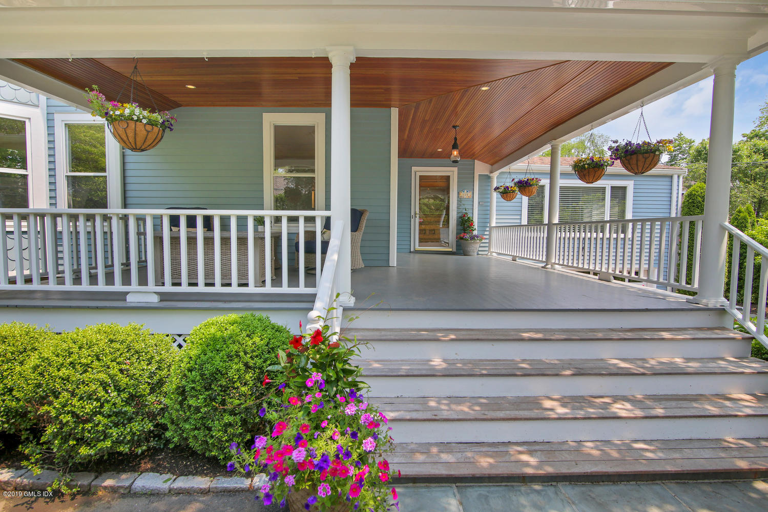 115 Riverside Avenue Riverside, CT 06878 - Photo 3 of 28 a view of a porch with a bench