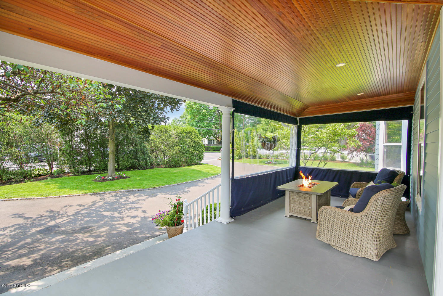 115 Riverside Avenue Riverside, CT 06878 - Photo 4 of 28 a view of a patio with table and chairs potted plants and floor to ceiling window