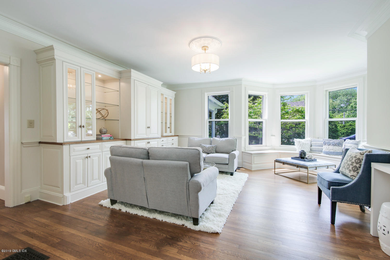 115 Riverside Avenue Riverside, CT 06878 - Photo 6 of 28 a living room with furniture and large windows