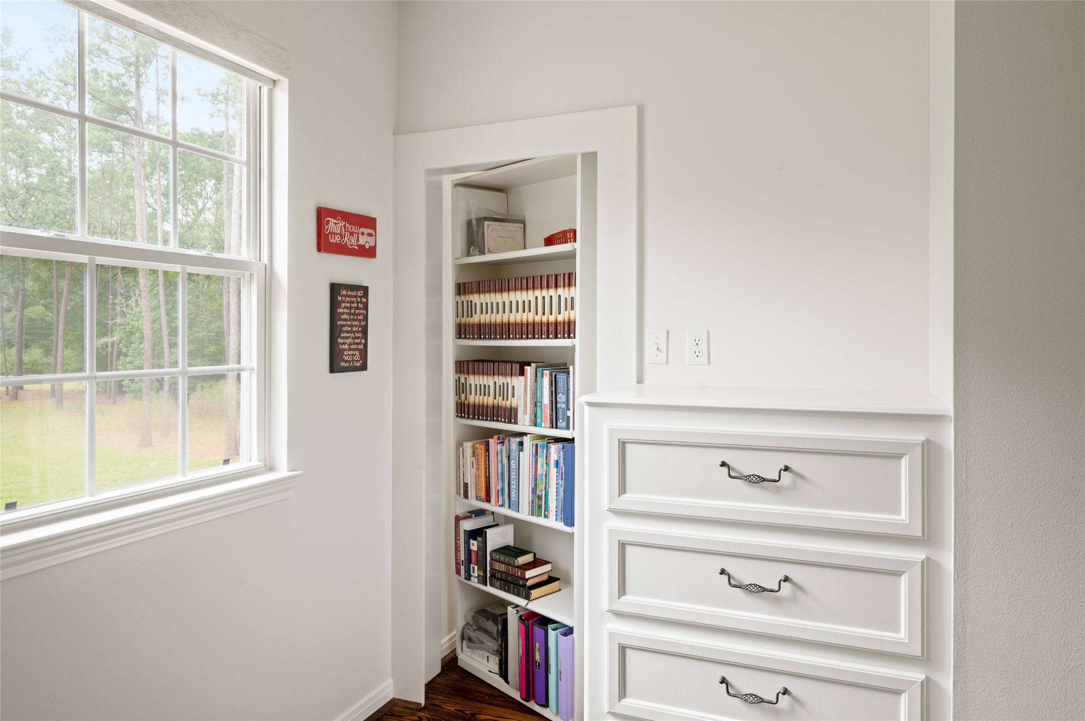 20103 Mahogany Ridge Drive Magnolia, TX 77355 - Photo 28 of 42 Discover the charm of a hidden shelf door that seamlessly opens to unveil a spacious bedroom closet, perfect for both style and storage.