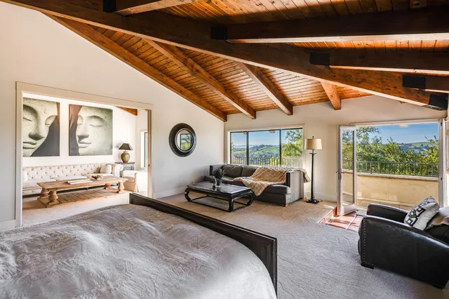 a view of a chairs and table in the patio