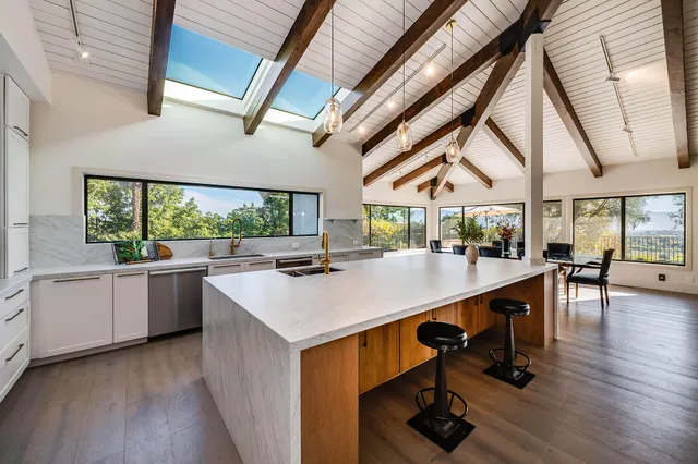 a bed room with furniture and a large window
