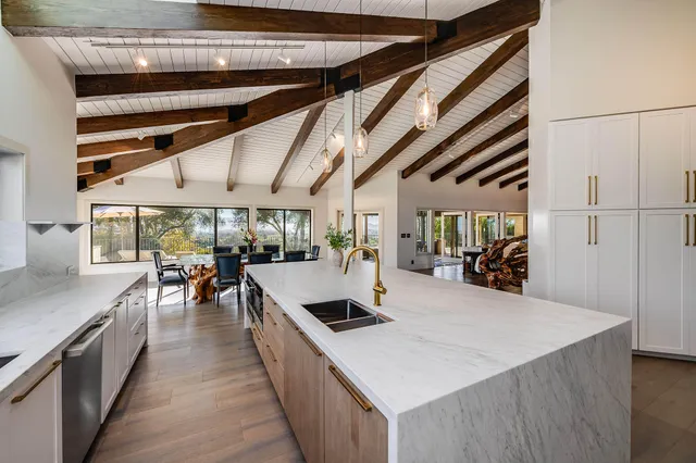 a view of swimming pool with seating area and furniture