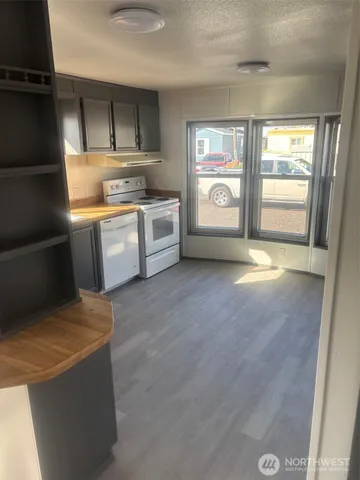 a kitchen with stainless steel appliances a stove and a refrigerator