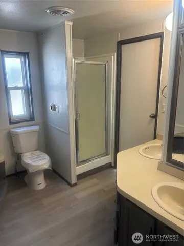 a bathroom with a sink toilet and mirror