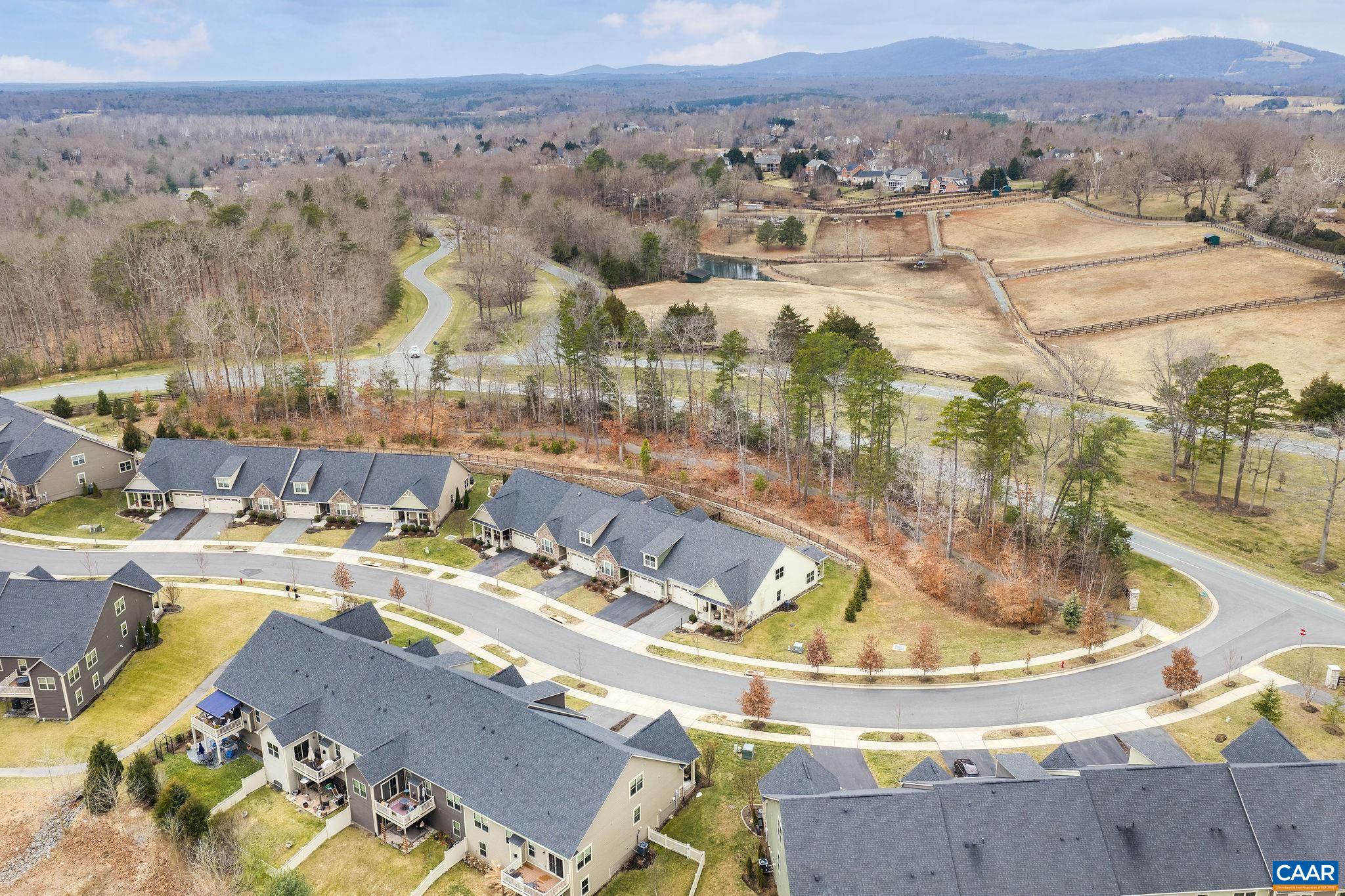 360 Winding Road Keswick, VA 22947 - Photo 2 of 48 a view of a swimming pool with a lake view