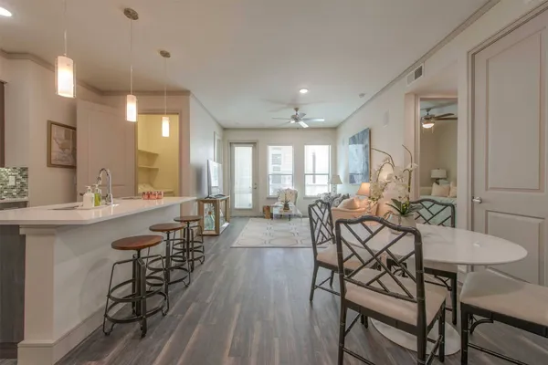 a view of a dining room with furniture and wooden floor