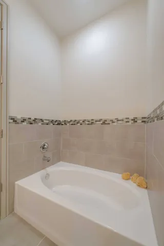 a bathroom with a bathtub and shower