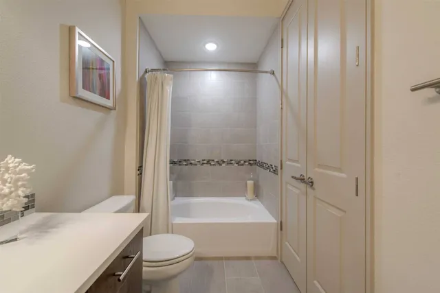 a bathroom with a bathtub toilet and sink