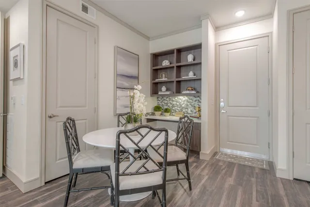 a view of a dining room with furniture and wooden floor