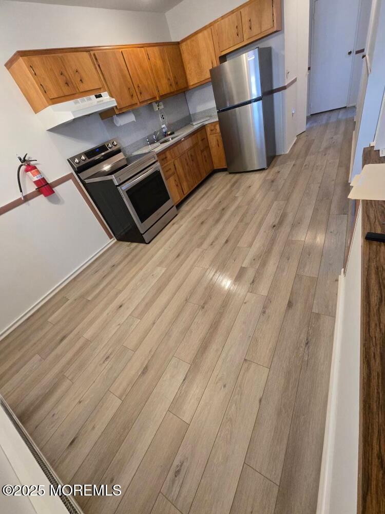106 Hope Road, Unit C Whiting, NJ 08759 - Photo 2 of 11 a living room with wooden floor
