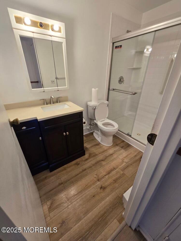 106 Hope Road, Unit C Whiting, NJ 08759 - Photo 4 of 11 a bathroom with a sink vanity mirror and toilet
