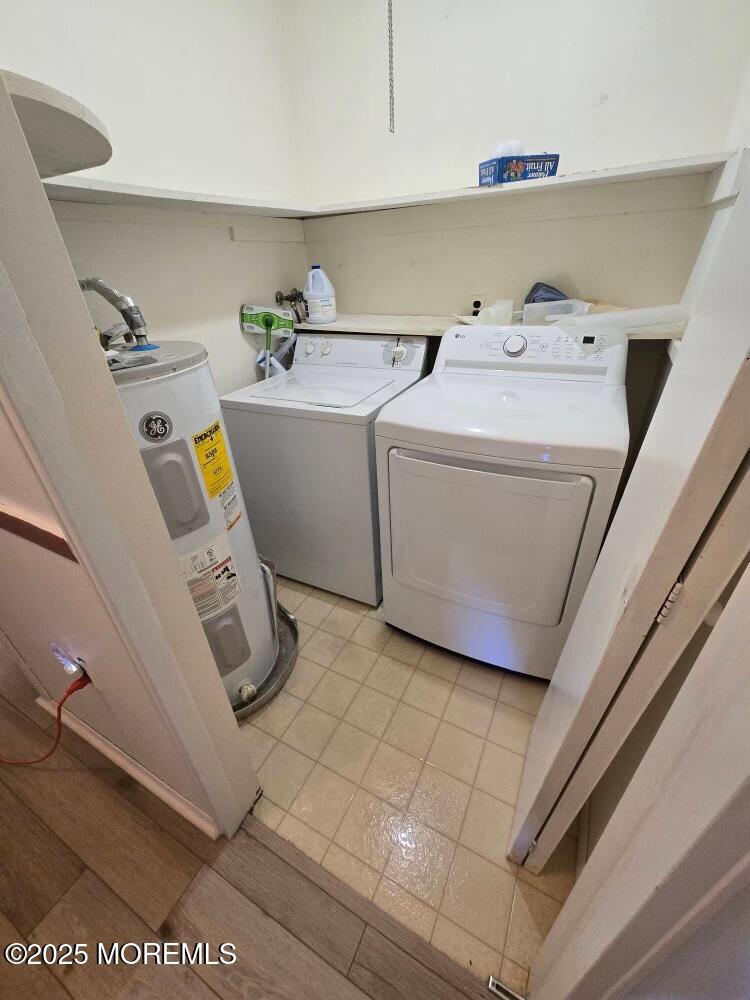 106 Hope Road, Unit C Whiting, NJ 08759 - Photo 6 of 11 a utility room with dryer and washer