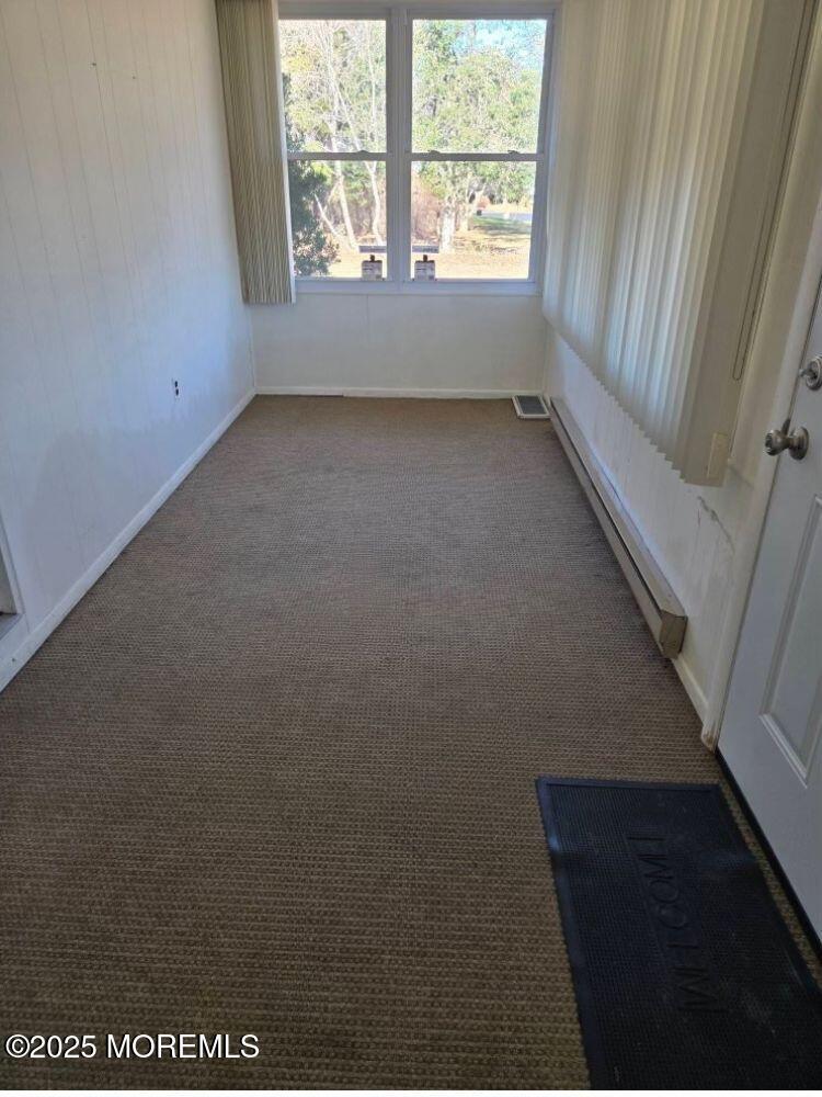 106 Hope Road, Unit C Whiting, NJ 08759 - Photo 8 of 11 a view of an empty room with a window