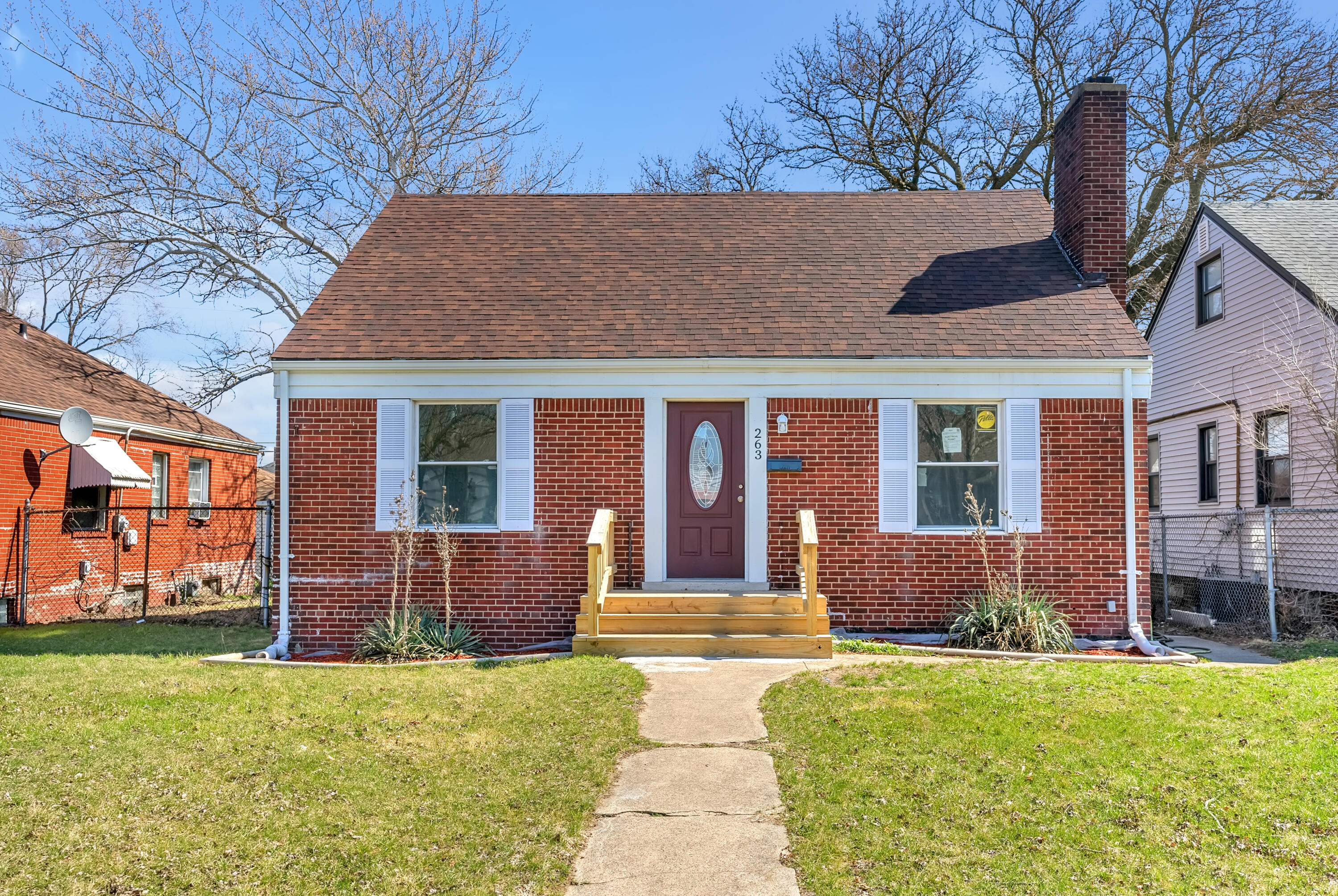 263 Rutledge Street Gary, IN 46404 - Photo 1 of 21 a front view of a house with garden