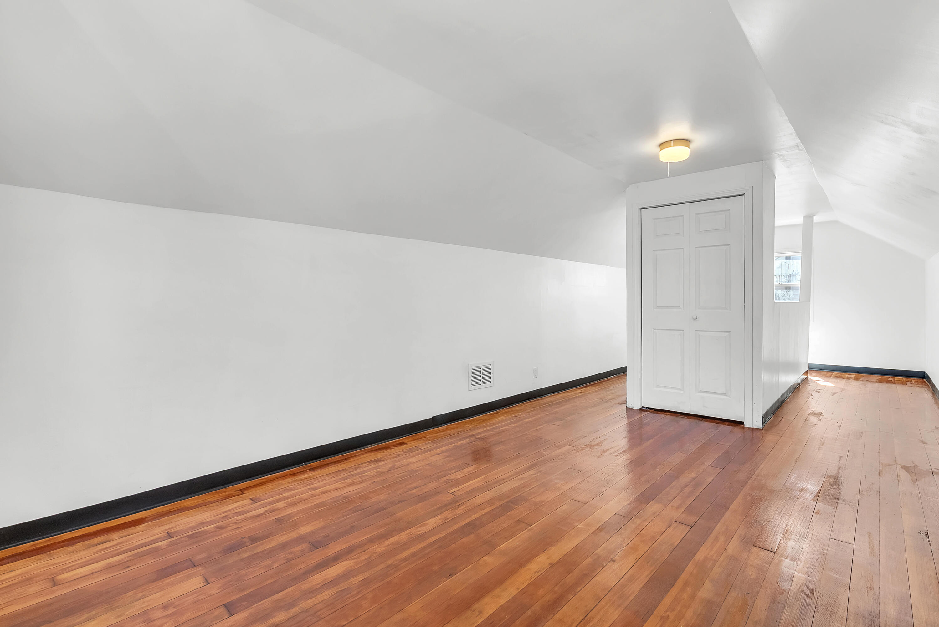 263 Rutledge Street Gary, IN 46404 - Photo 18 of 21 a view of an empty room and wooden floor