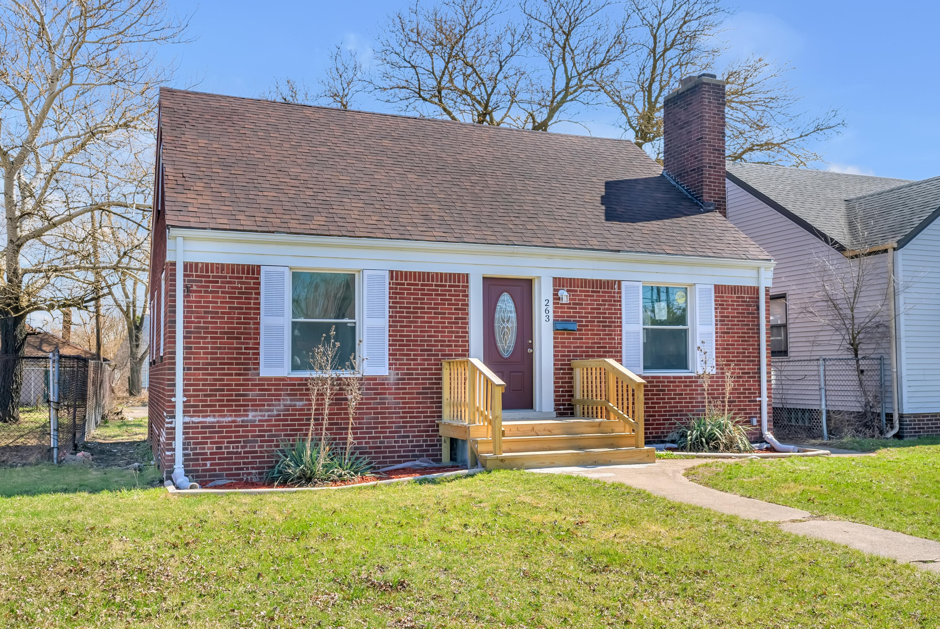 263 Rutledge Street Gary, IN 46404 - Photo 5 of 21 a front view of house with yard and outdoor seating